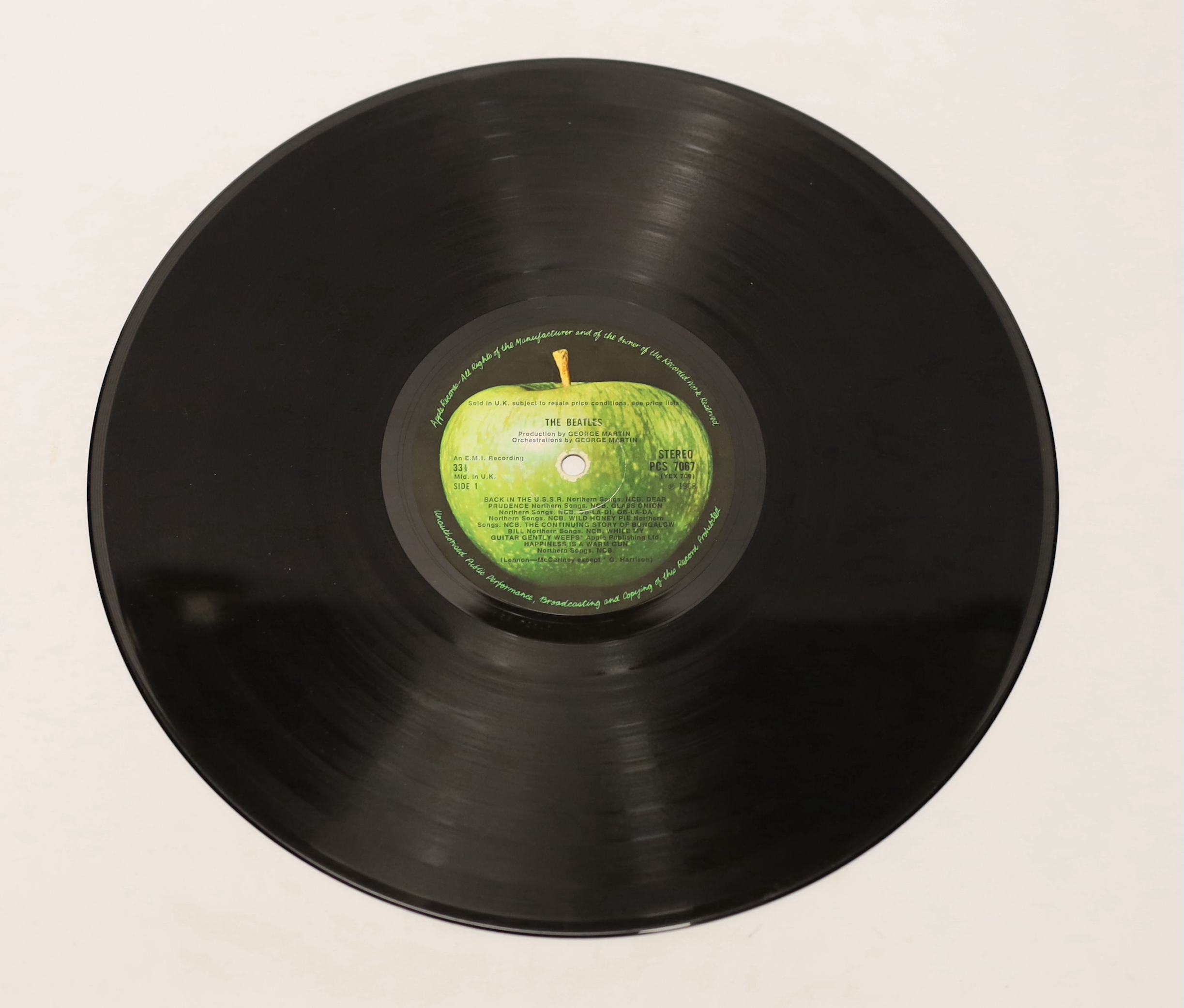 The Beatles; The White Album, top opening cover numbered 0557785, two LPs with set of four photographs and booklet, missing inner sleeves
